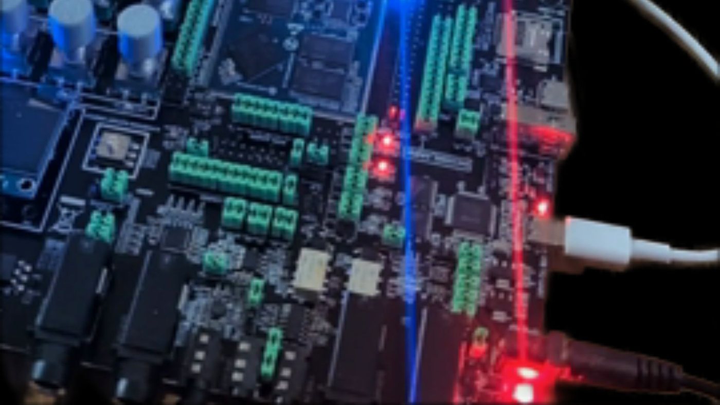 A macro of the Stomp's board: green connectors, red and blue light across the PCB.